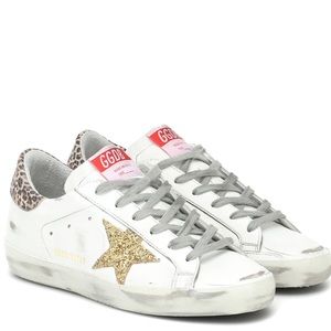 Gold glitter star golden goose with a faded leopard back. New without tags.
